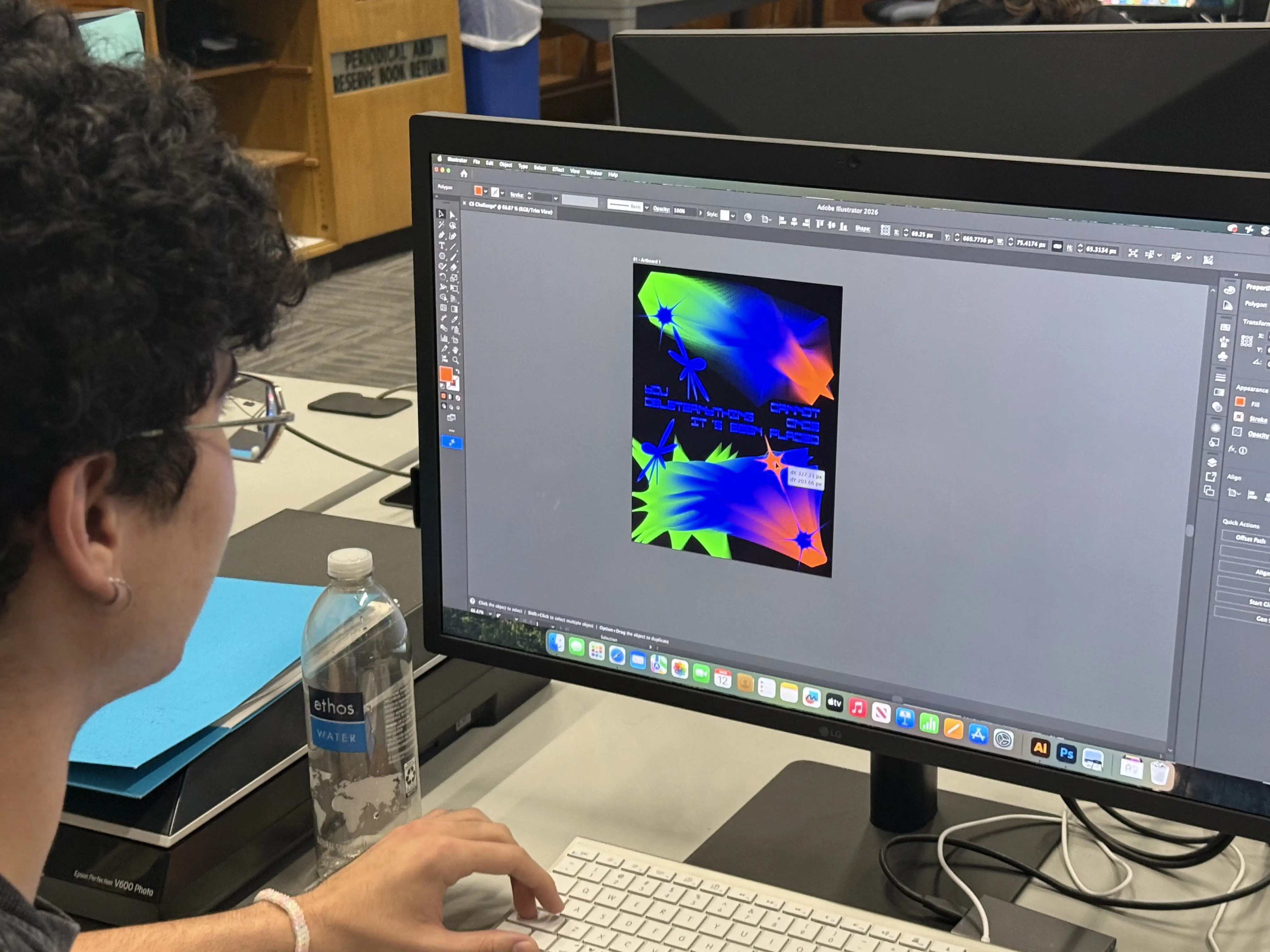 Participant making a poster layout on a computer